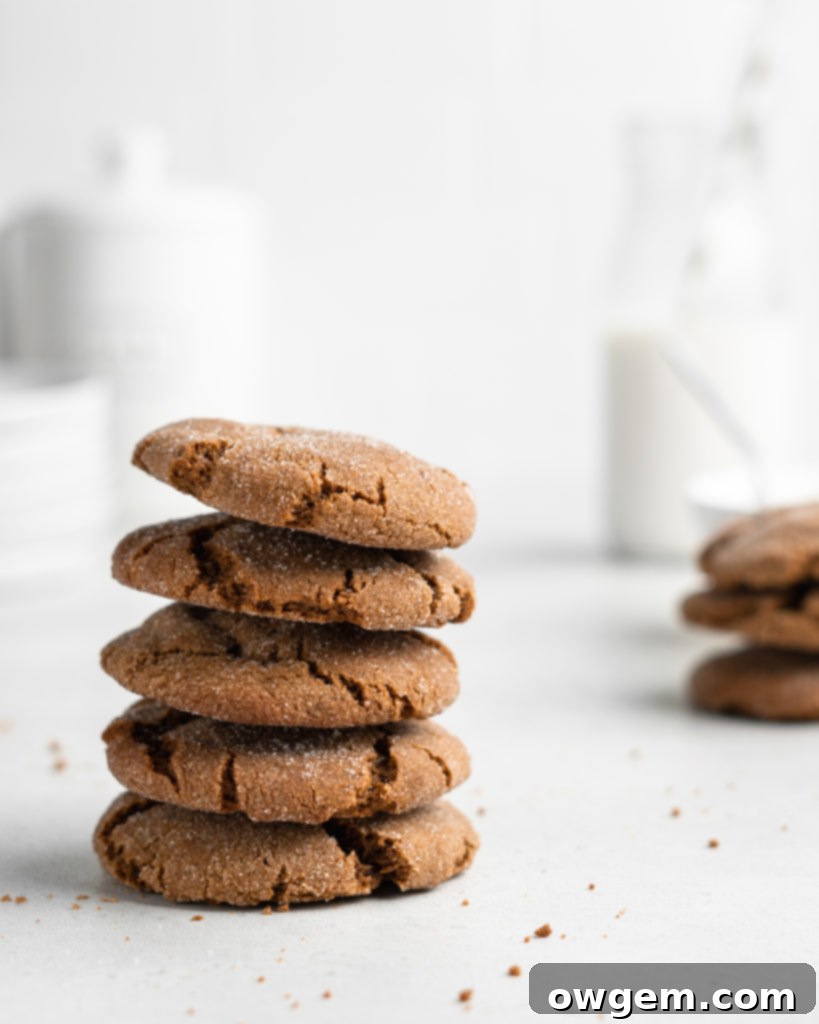 Super chewy and full of Christmas flavor, these crackly topped Cardamom Gingerbread Molasses Cookies are a breeze to make!