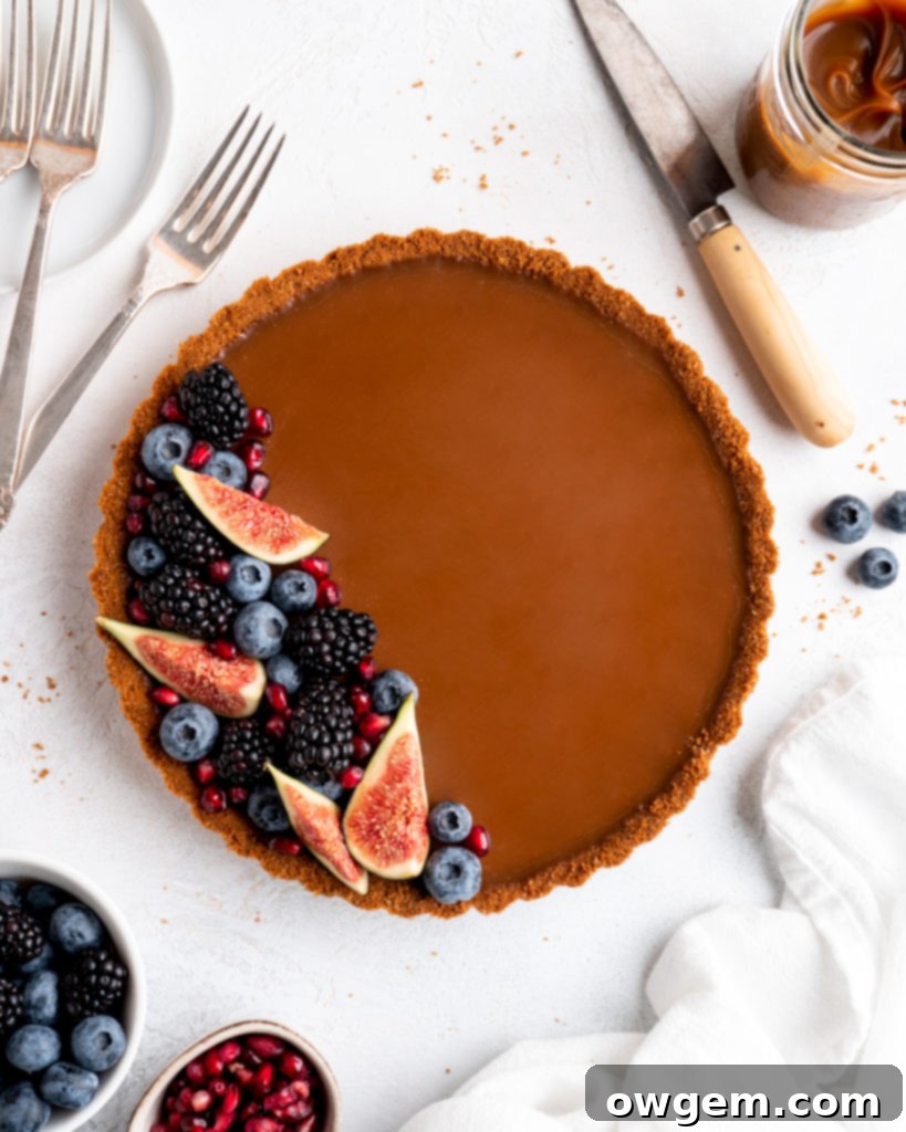 This Caramelized White Chocolate Tart features a silky, creamy caramelized white chocolate ganache filling inside a crunchy biscoff crust