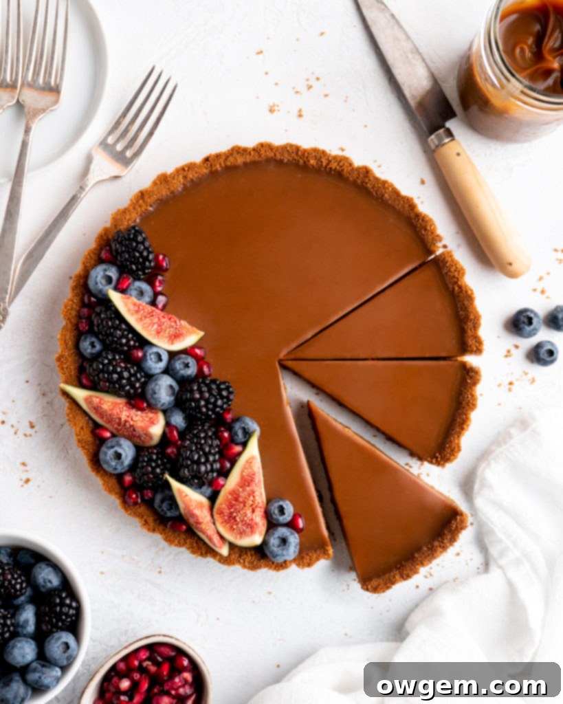 This Caramelized White Chocolate Tart features a silky, creamy caramelized white chocolate ganache filling inside a crunchy biscoff crust