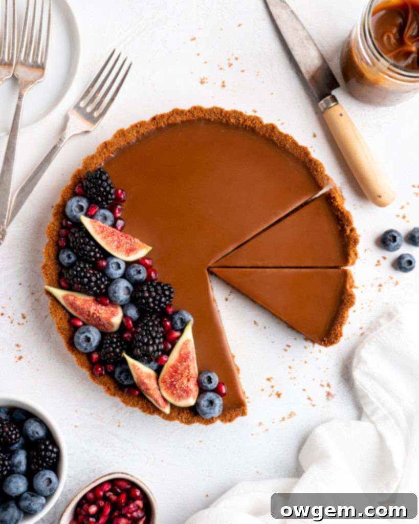 This Caramelized White Chocolate Tart features a silky, creamy caramelized white chocolate ganache filling inside a crunchy biscoff crust