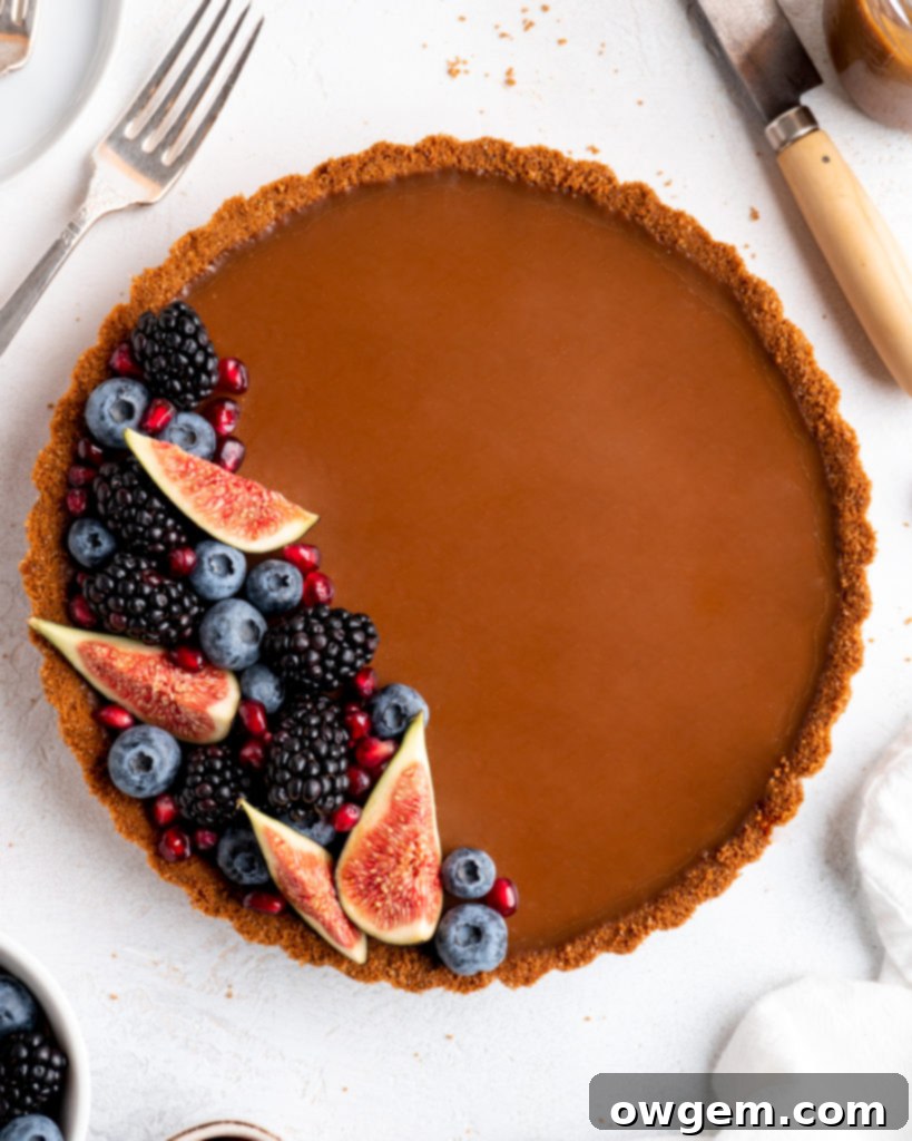 This Caramelized White Chocolate Tart features a silky, creamy caramelized white chocolate ganache filling inside a crunchy biscoff crust