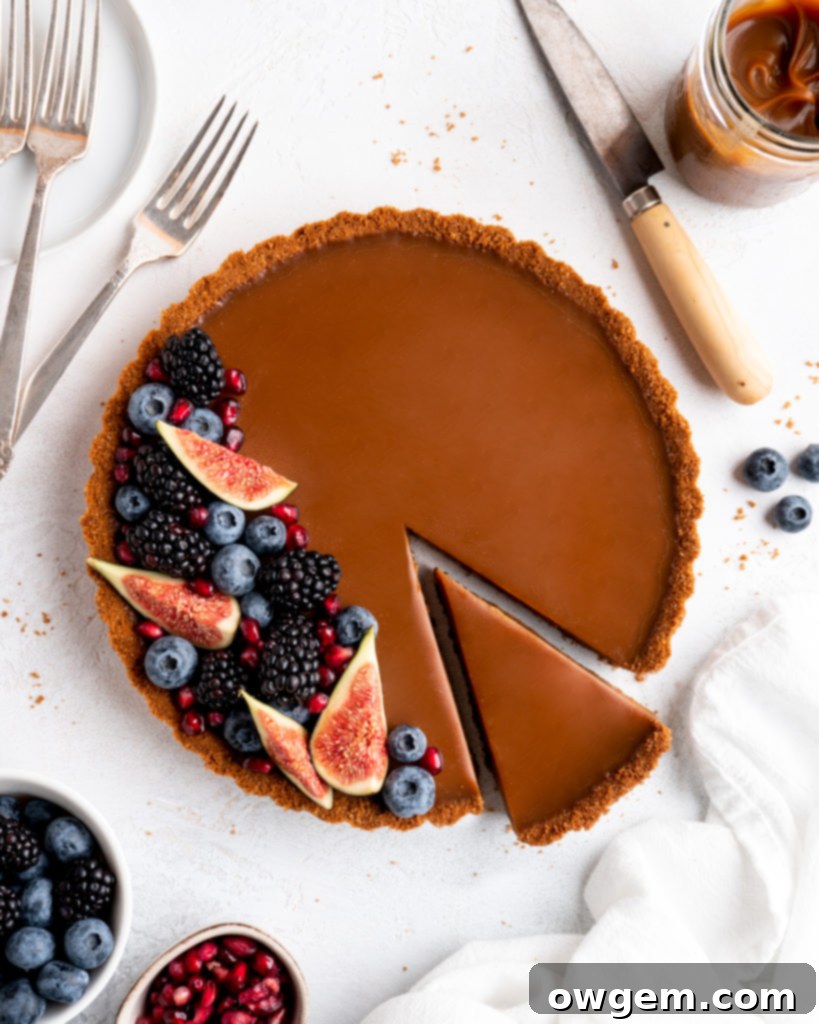 This Caramelized White Chocolate Tart features a silky, creamy caramelized white chocolate ganache filling inside a crunchy biscoff crust