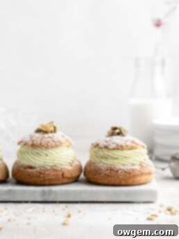 Cream Puff with craquelin topping, filled with a thick piped layer of whipped pistachio white chocolate ganache