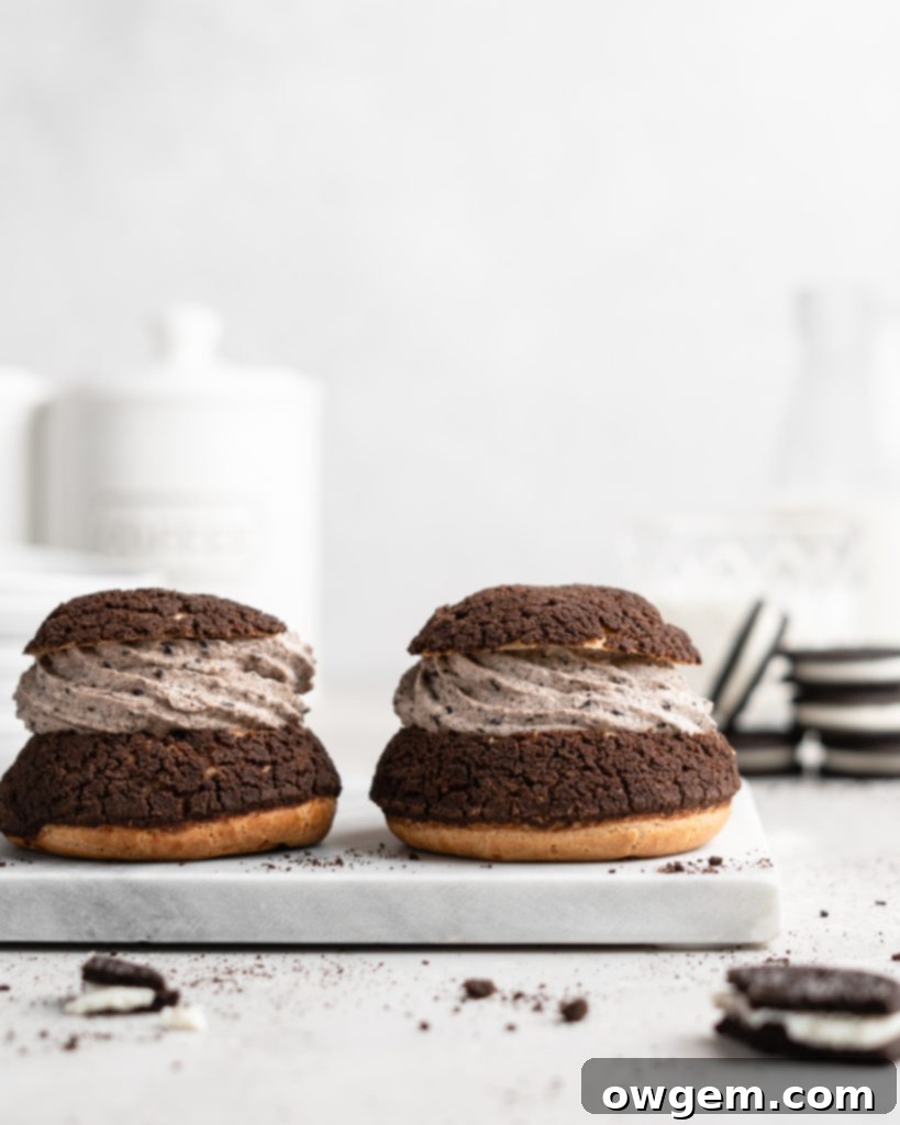 Cream Puffs topped with a chocolate craquelin, filled with an Oreo cheesecake filling