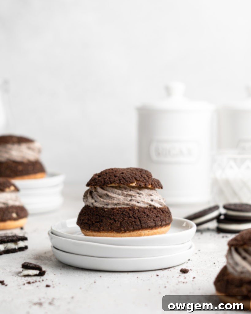 Cream Puffs topped with a chocolate craquelin, filled with an Oreo cheesecake filling