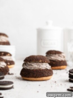 Cream Puffs topped with a chocolate craquelin, filled with an Oreo cheesecake filling