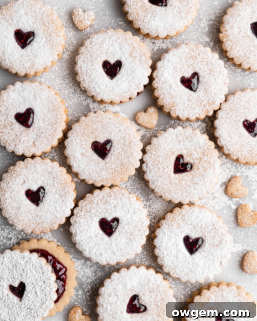 Assembled Linzer Cookies with raspberry jam and powdered sugar, ready to eat