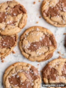 Chewy golden Toffee Milk Chocolate Chip Cookies on marble counter