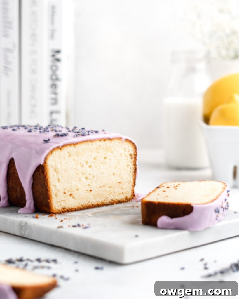 Close-up of a perfectly baked and glazed Lemon and lavender loaf cake slice
