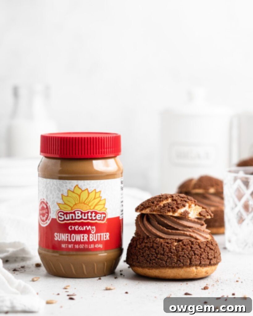 Decadent cream puffs adorned with a crisp chocolate craquelin, generously filled with a velvety SunButter Milk Chocolate whipped ganache