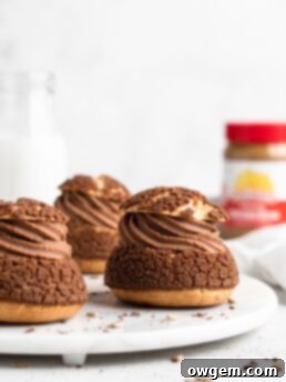 Cream puffs topped with a chocolate craquelin, filled with a creamy SunButter Milk Chocolate whipped ganache filling