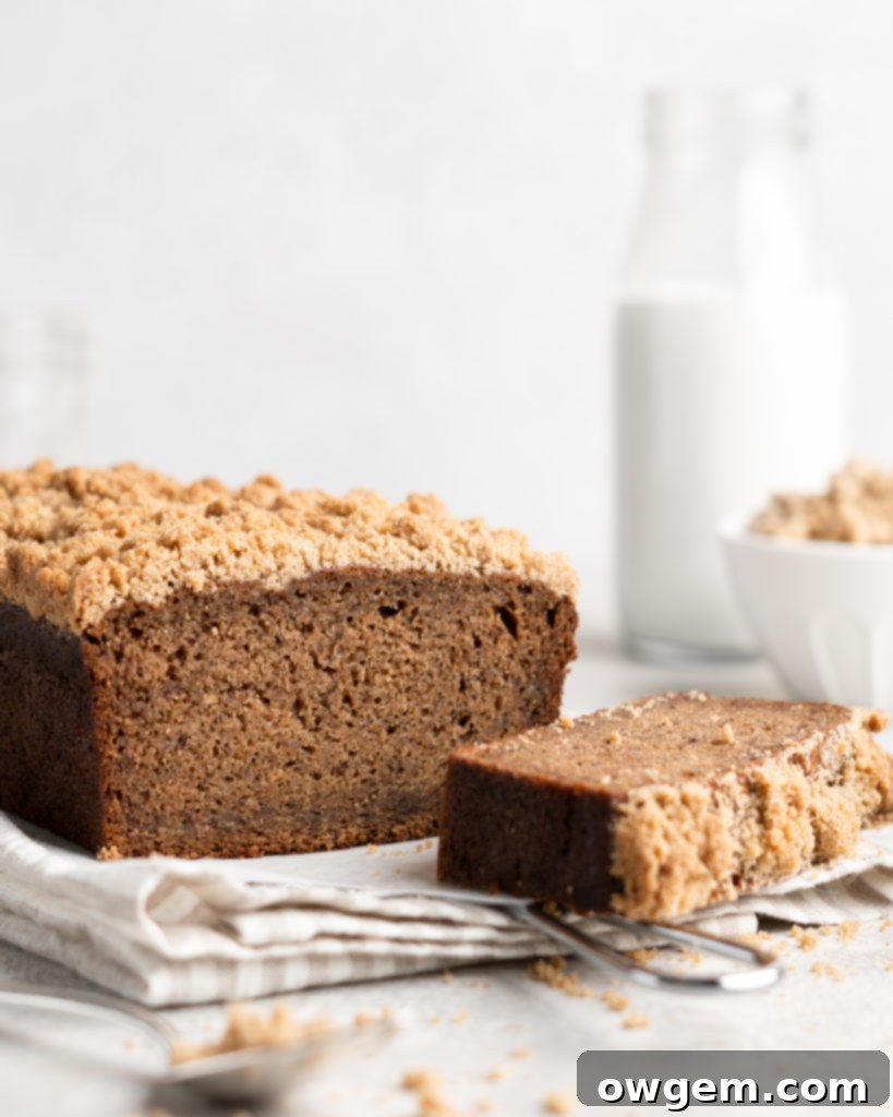 A close-up of the moist interior of Chai Spiced Banana Bread, revealing its tender crumb and delightful streaks of mashed banana.