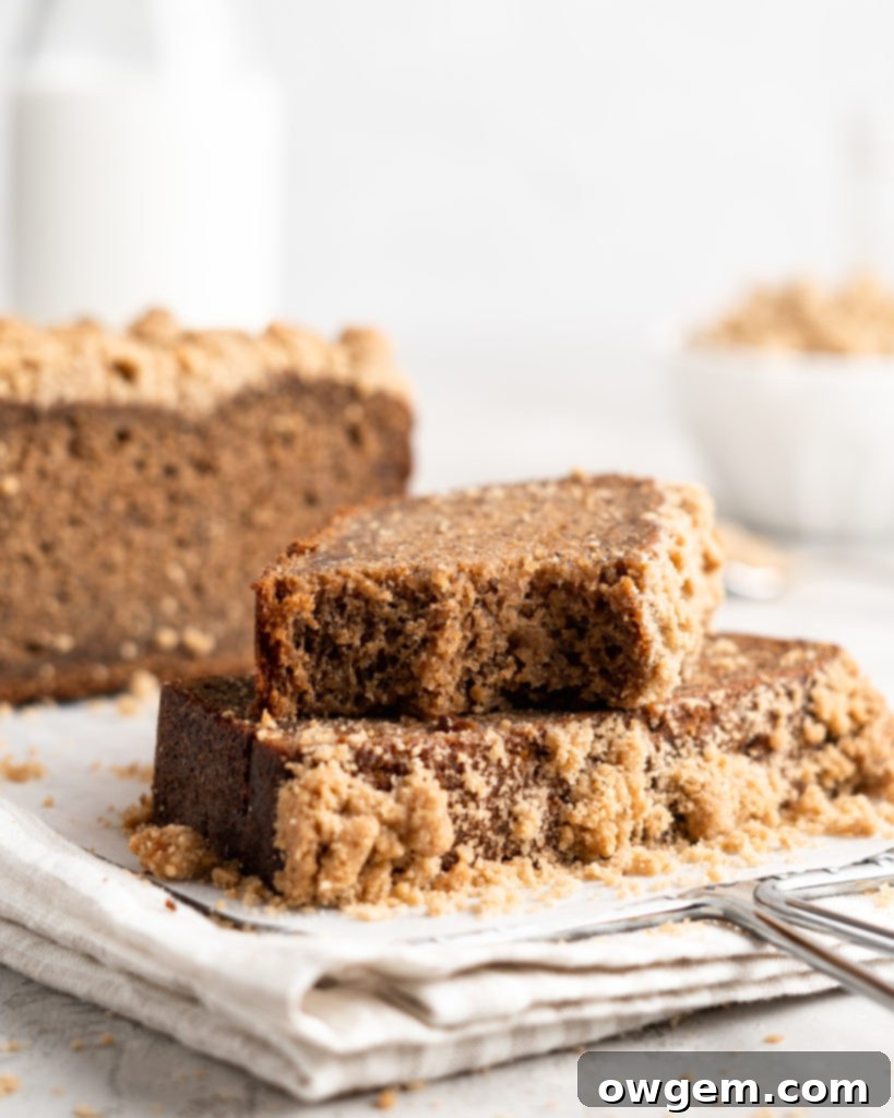 Another perspective of Chai Spiced Banana Bread, showcasing its perfectly golden crust and streusel topping, fresh from the oven.