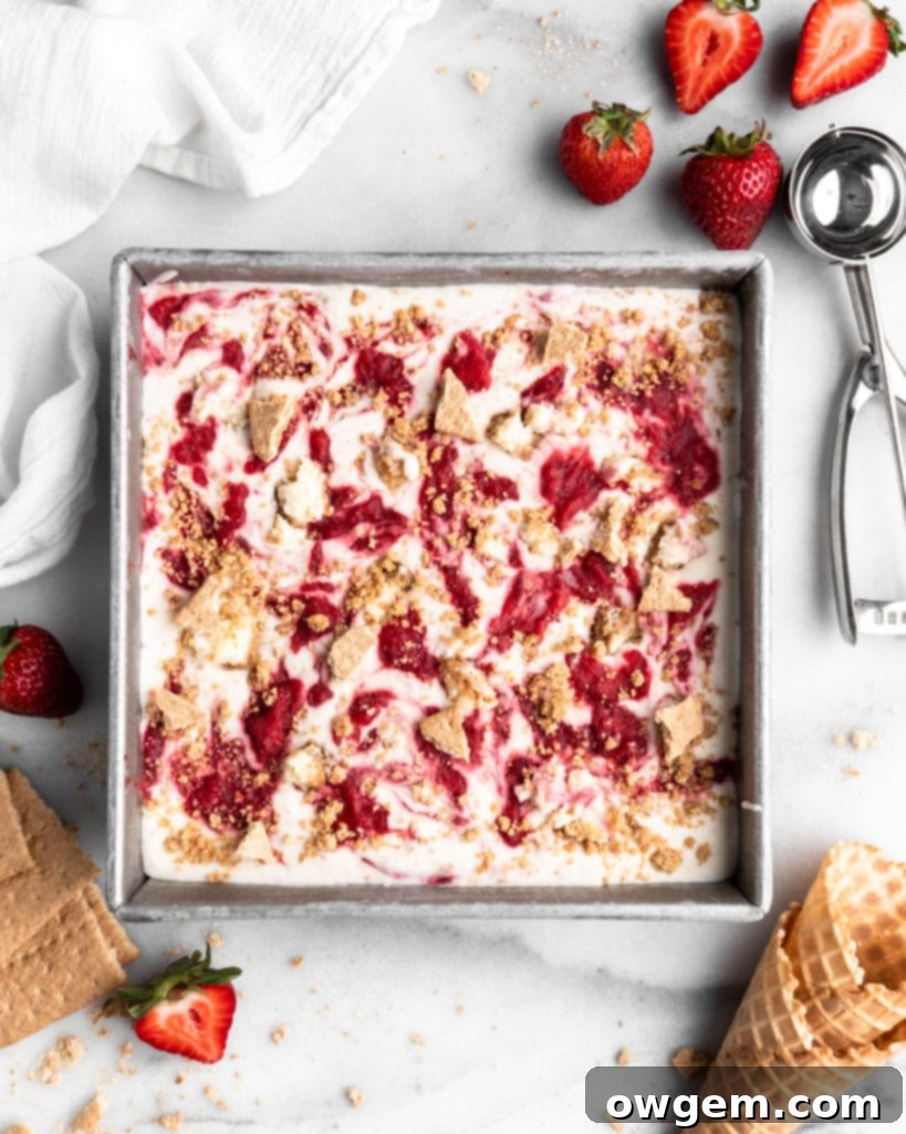 No Churn Strawberry Cheesecake Ice Cream in a square pan