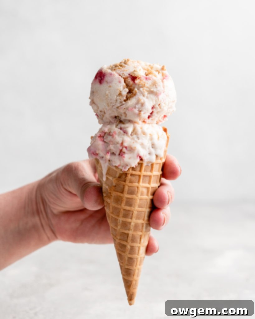 No Churn Strawberry Cheesecake Ice Cream in a cone