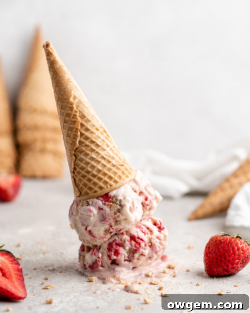 No Churn Strawberry Cheesecake Ice Cream in a cone