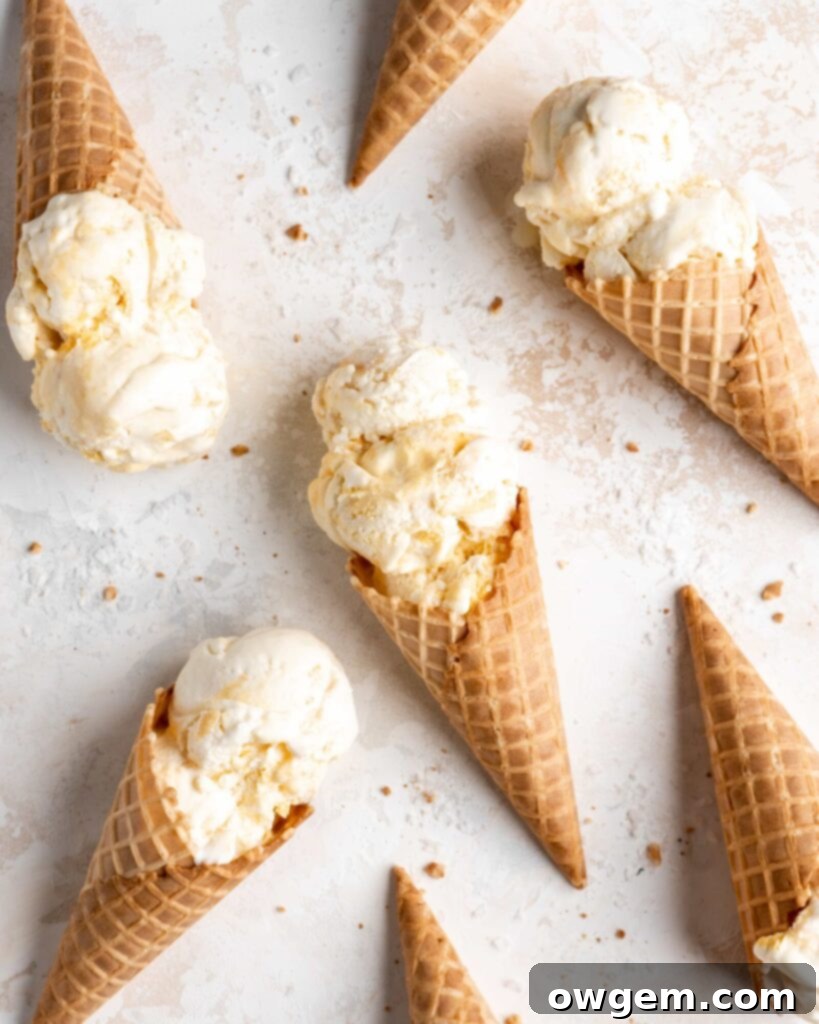 Homemade no-churn salted honey and peach ice cream served in crispy waffle cones