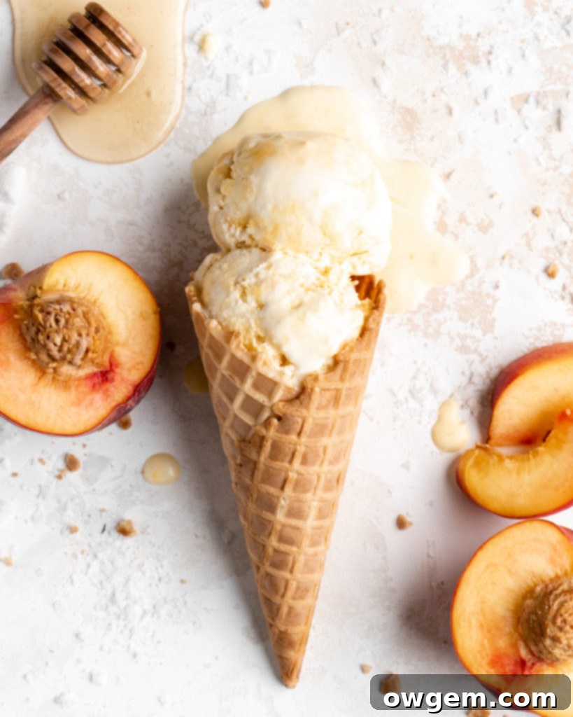 Close-up of homemade salted honey and peach no-churn ice cream in a waffle cone