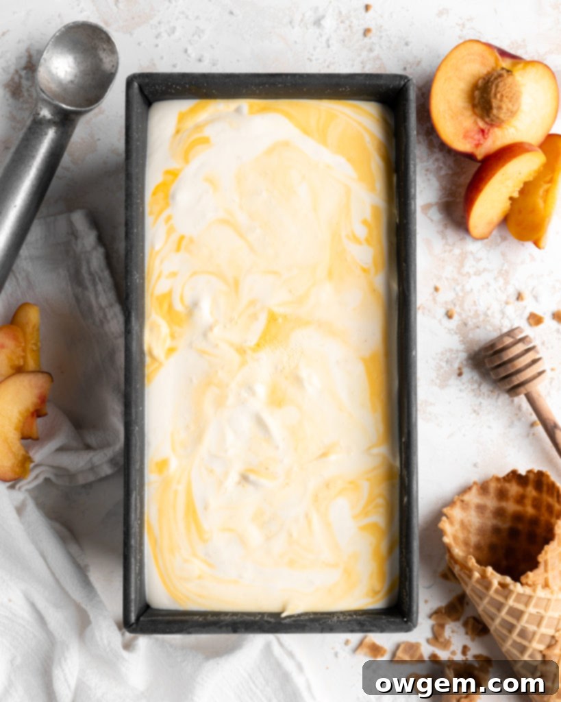 Large baking dish filled with homemade salted honey and peach no-churn ice cream before freezing