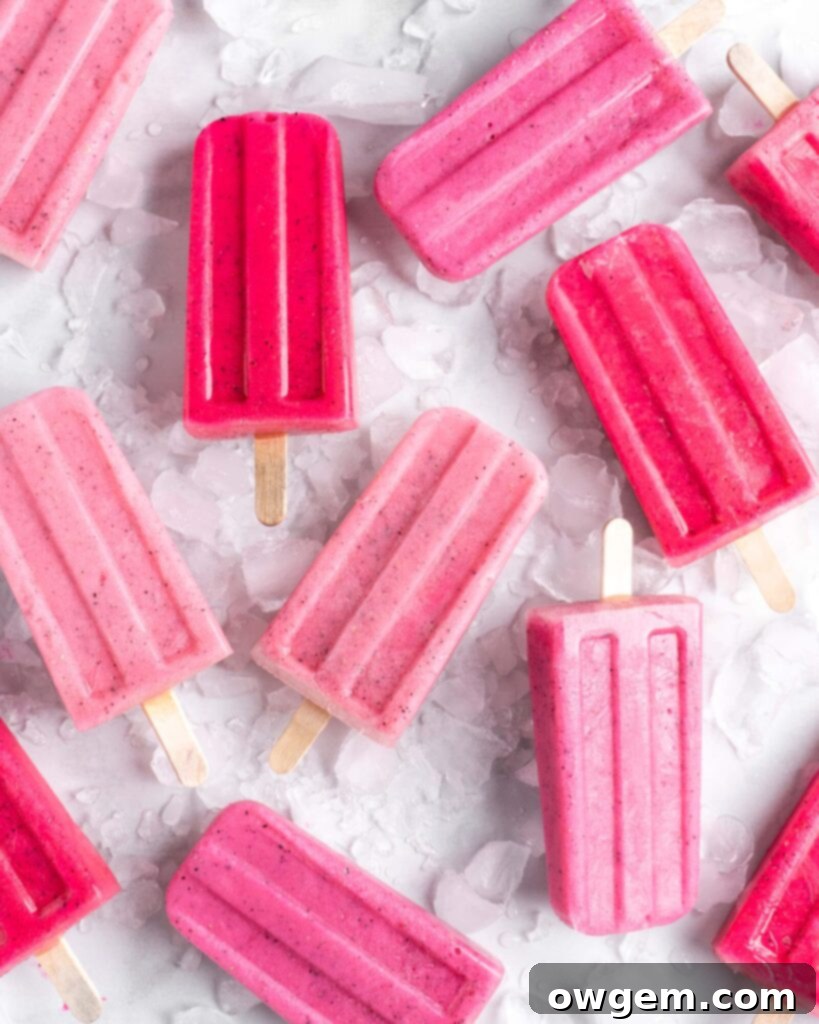 Bright pink popsicles are made with guava juice, dragon fruit (pitaya), greek yogurt, and agave.