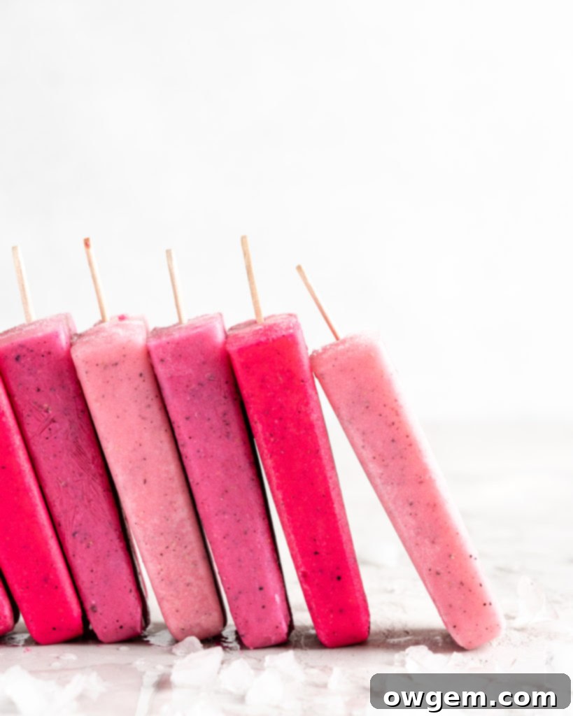 Bright pink popsicles are made with guava juice, dragon fruit (pitaya), greek yogurt, and agave.