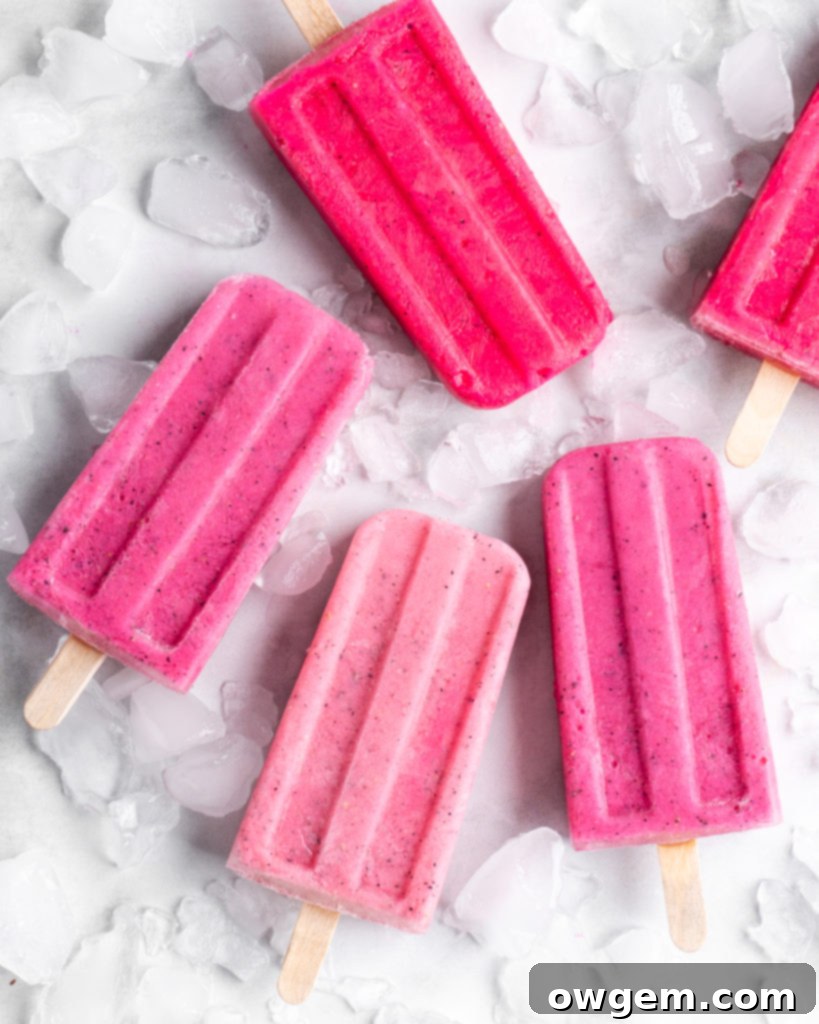 Bright pink popsicles are made with guava juice, dragon fruit (pitaya), greek yogurt, and agave.