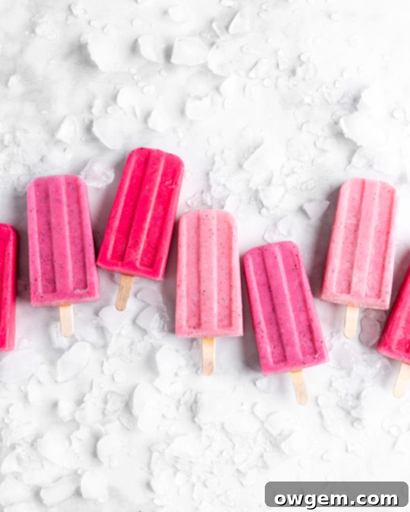 Bright pink popsicles are made with guava juice, dragon fruit (pitaya), greek yogurt, and agave.