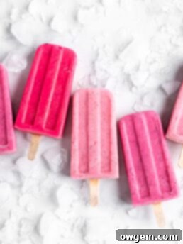 Bright pink popsicles are made with guava juice, dragon fruit (pitaya), greek yogurt, and agave.