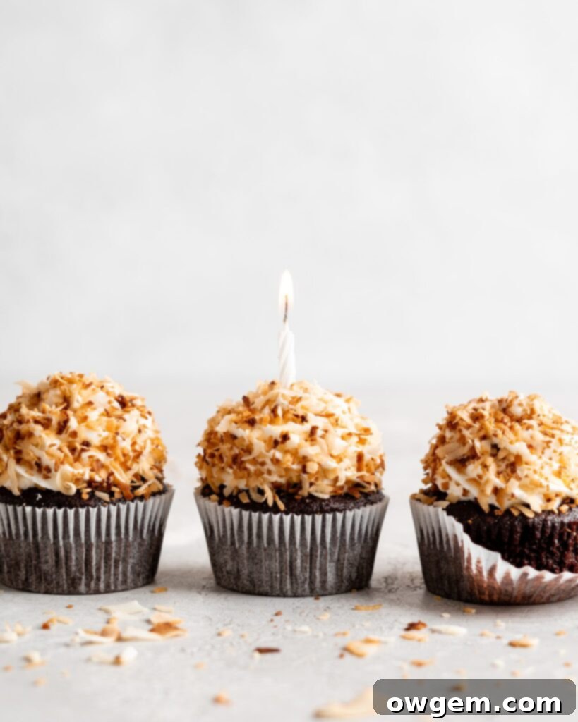 Delicious chocolate coconut cupcakes topped with creamy coconut frosting and toasted coconut flakes