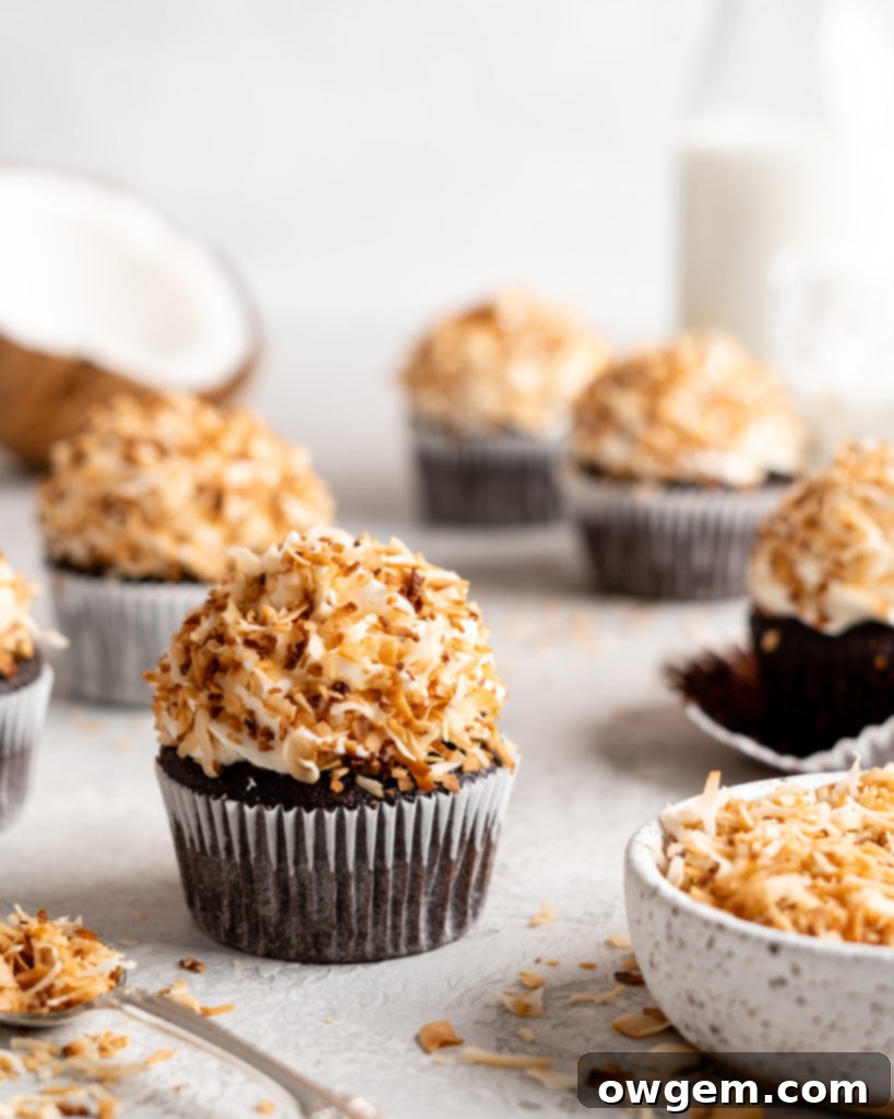 Close-up of a chocolate coconut cupcake batter being poured into a liner