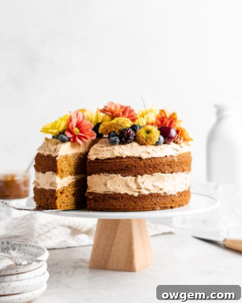 Close-up of a rustic brown butter pumpkin cake with two layers, showing the warm color and texture before frosting.