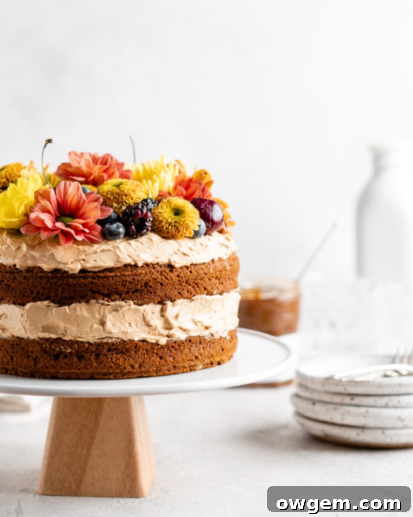 A freshly baked brown butter pumpkin cake layer resting on a wire rack, ready to be cooled and frosted.