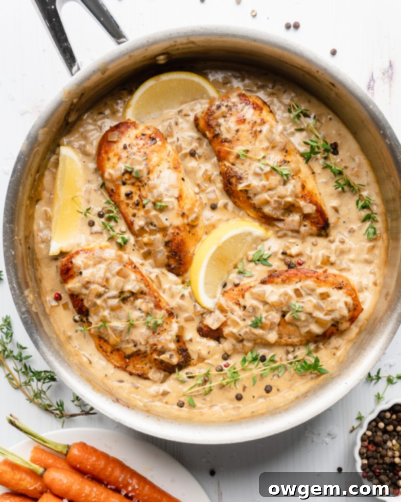 Chicken in pan, topped with white wine cream sauce
