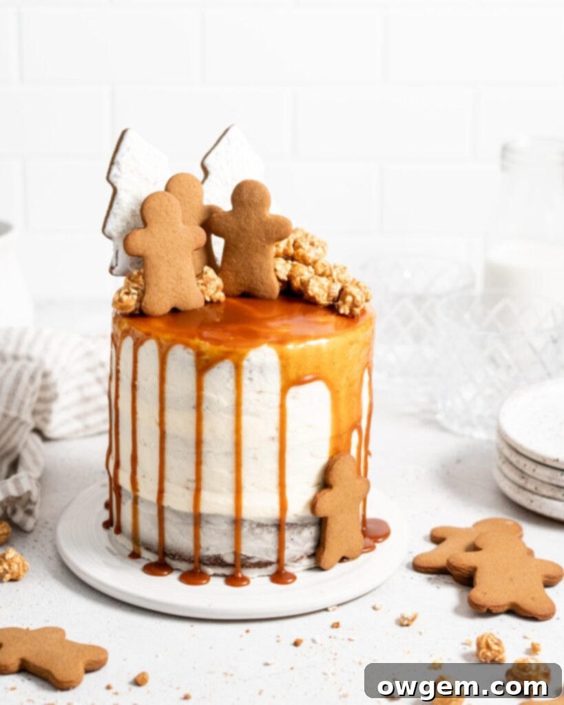 Close-up of gingerbread layer cake decorated with cream cheese frosting and a perfect salted caramel drip, ready for a holiday celebration