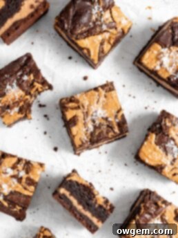 A delicious square of fudgy Peanut Butter Stuffed Brownie with a rich chocolate base and creamy peanut butter center, topped with a beautiful swirl.