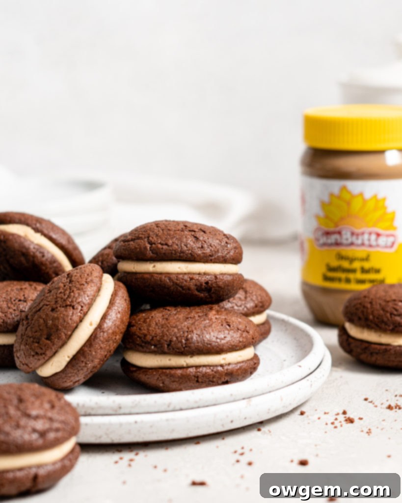 A single SunButter Chocolate Whoopie Pie cut in half, revealing the thick layer of creamy SunButter filling.