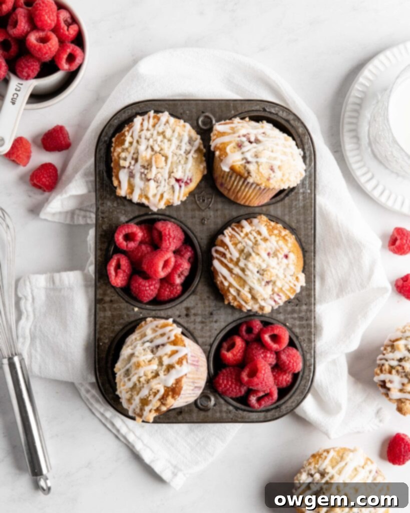 Fluffy and tall Buttermilk Raspberry Muffins with streusel topping