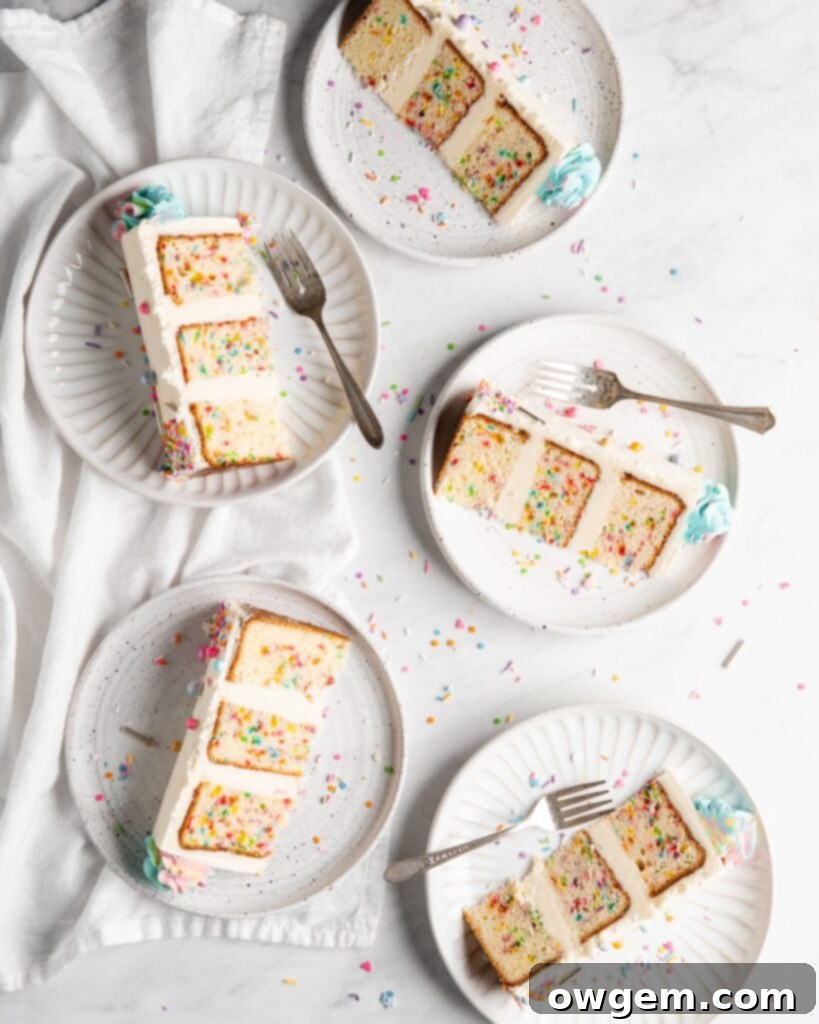 Even Better Confetti Cake slices revealing colorful sprinkles inside