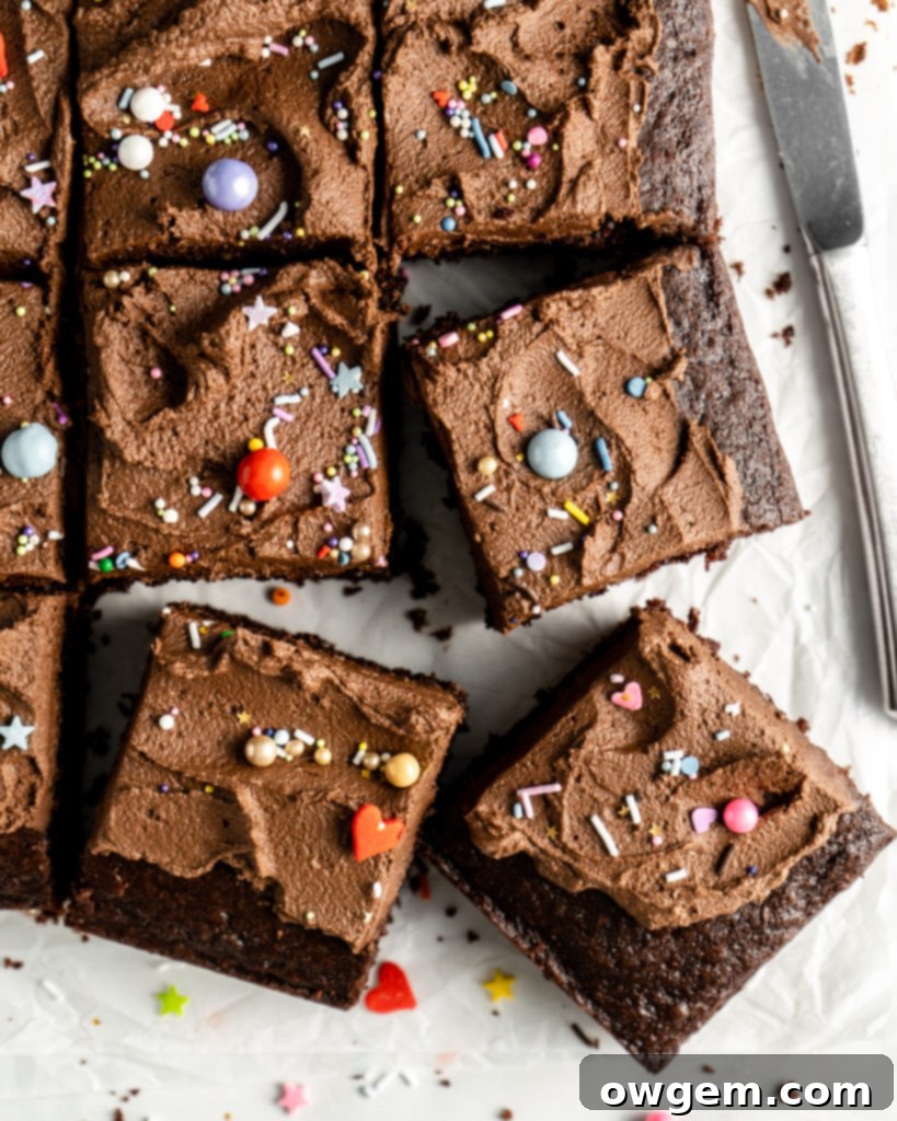Close-up of the SunButter Chocolate Sheet Cake with a rich chocolate crumb and a thick layer of SunButter Chocolate Buttercream, adorned with sprinkles.