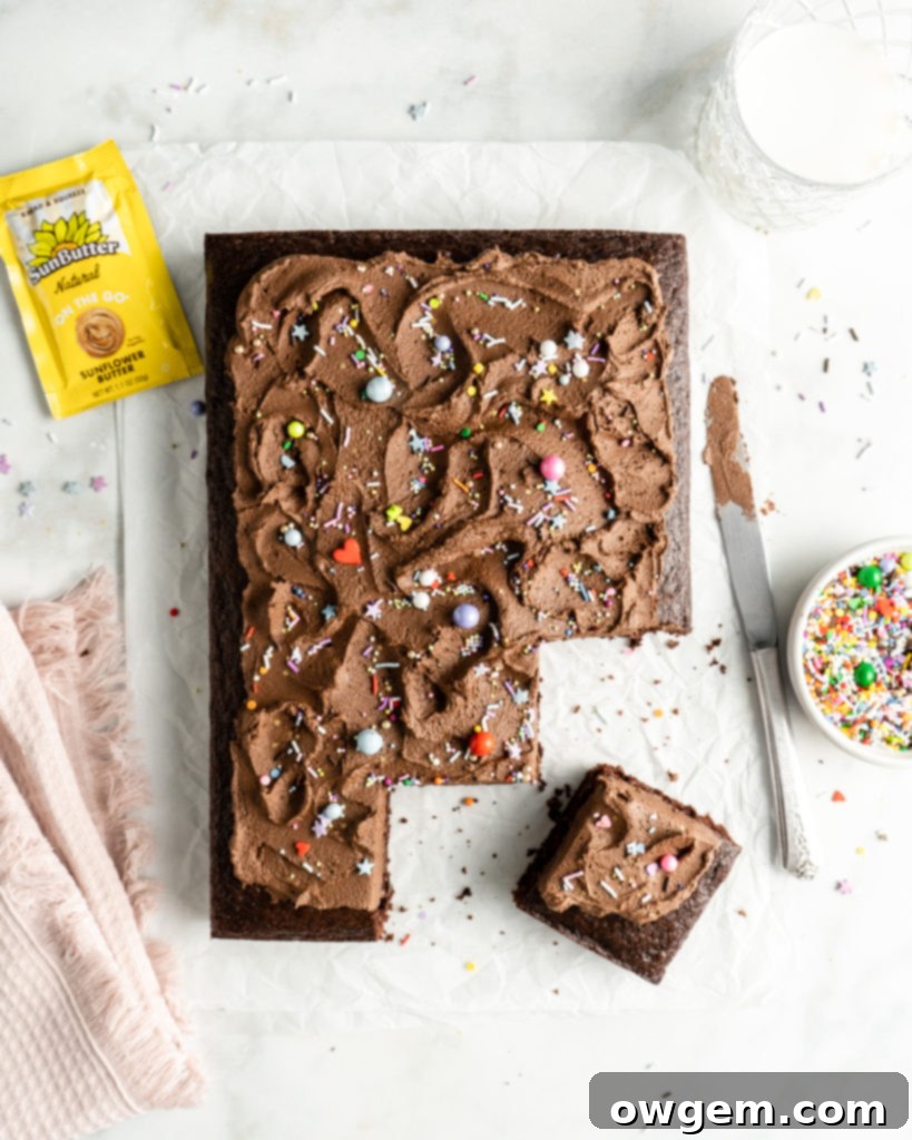 Another perspective of the freshly frosted SunButter Chocolate Sheet Cake, highlighting the smooth texture of the buttercream and festive sprinkles.