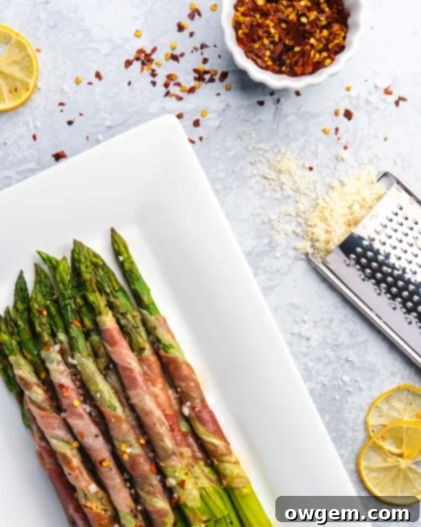 Crispy prosciutto wrapped around fresh green asparagus, ready to be eaten