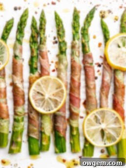 Crispy prosciutto wrapped around fresh green asparagus fresh from the oven