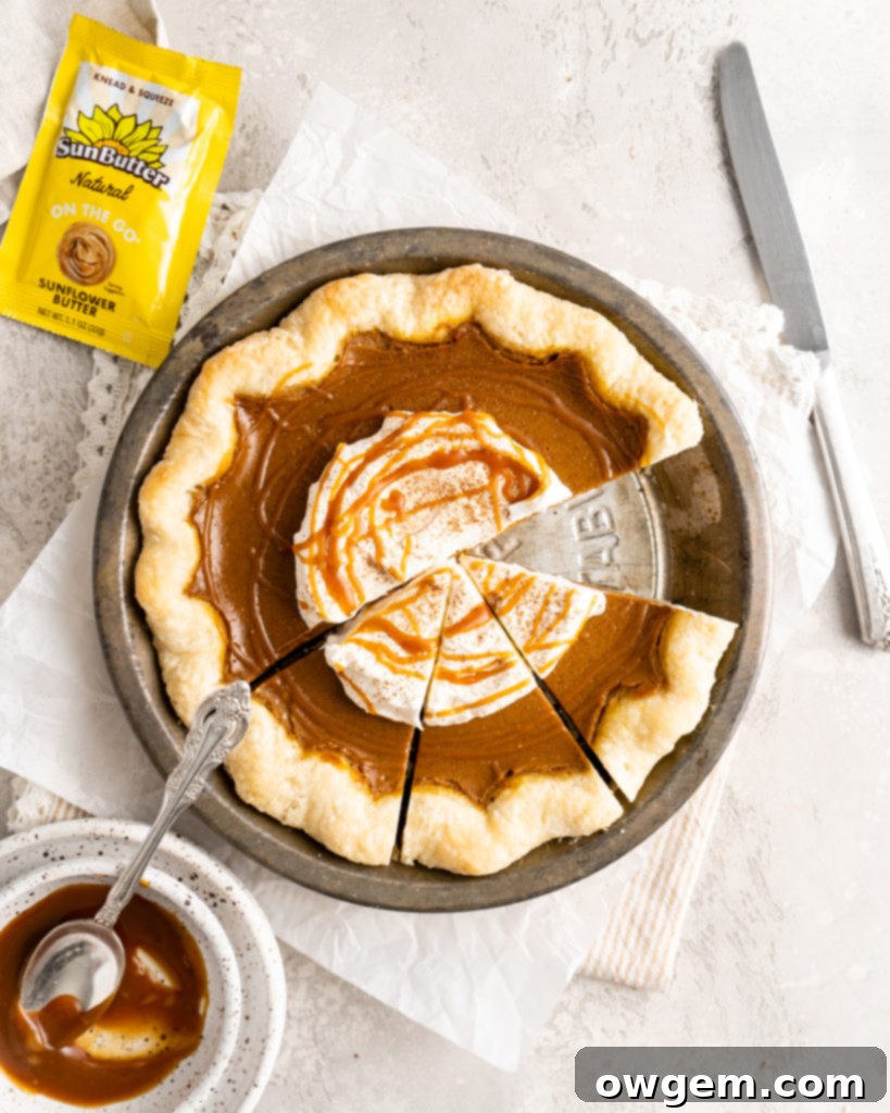 Raw SunButter Salted Caramel Pumpkin Pie filling in a pie crust before baking