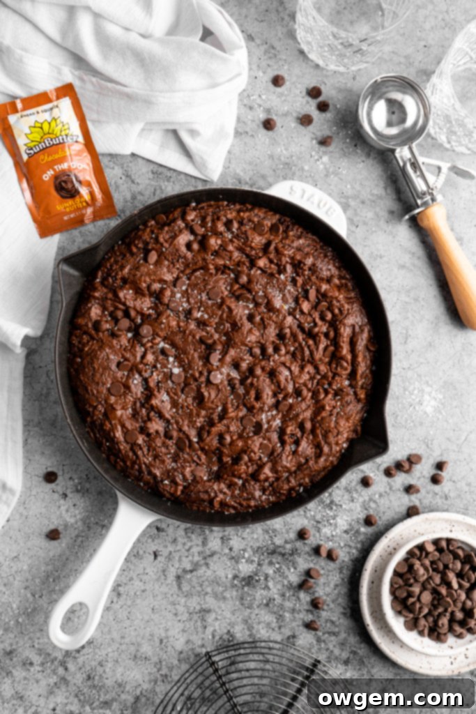 Close-up of a warm SunButter Triple Chocolate Brownie Skillet with melted chocolate chips