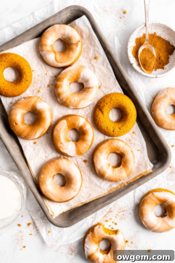 Stack of freshly baked pumpkin spice latte donuts with marble glaze