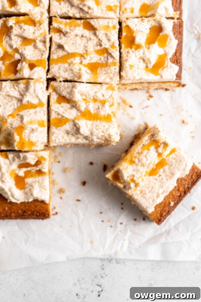Bourbon Eggnog Sheet Cake with fluffy eggnog frosting, drizzled with caramel sauce