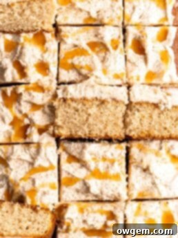 Bourbon Eggnog Sheet Cake with fluffy eggnog frosting, drizzled with caramel sauce