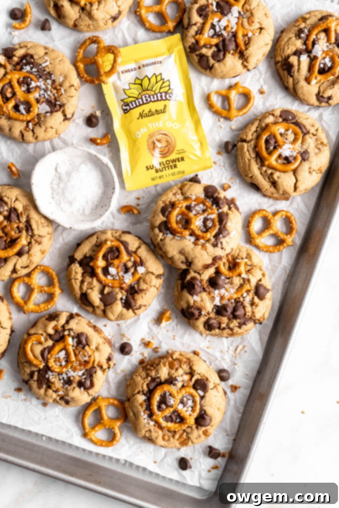 Thick and chewy SunButter Toffee Pretzel Cookies with lots of chocolate chips, toffee, and pretzels