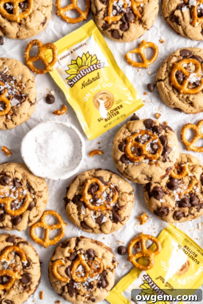 A SunButter Toffee Pretzel Cookie broken in half to show the green tint inside