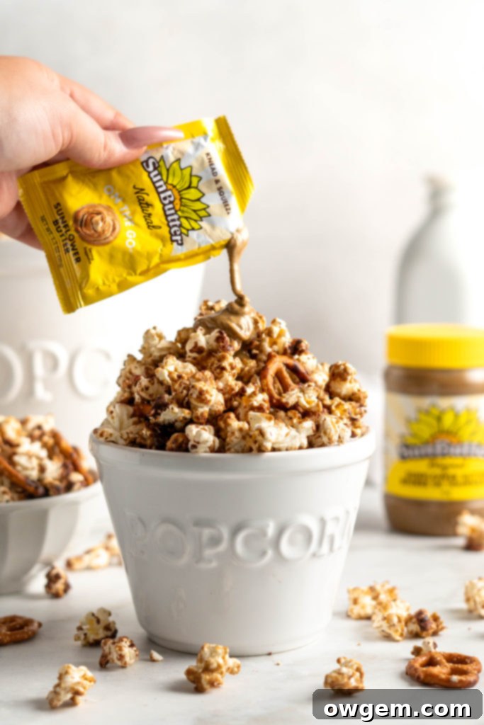 Sweet SunButter Caramel Popcorn mixed with salty pretzels and creamy chocolate
